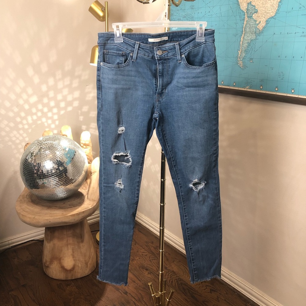 Levi’s 311 Distressed frayed hem Jeans